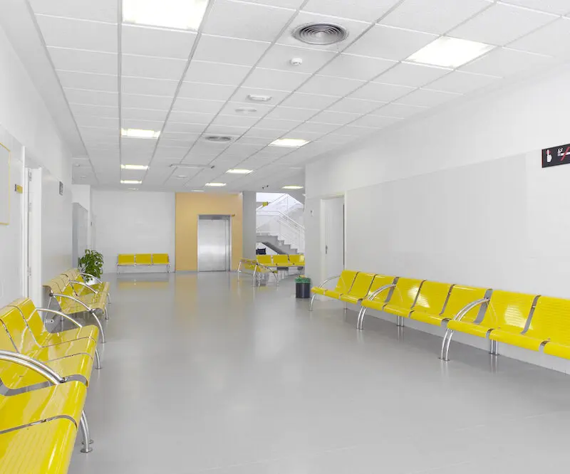 hospital building interior with yellow seats